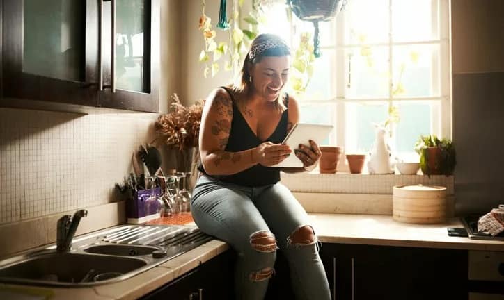 woman on kitchen counter in apartment zhAoe.width .jpg