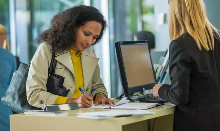 bank customer writing check Vgpp.width .jpg
