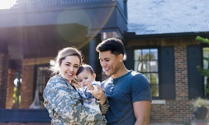 female veteran with baby and husband JxapTO.width .jpg