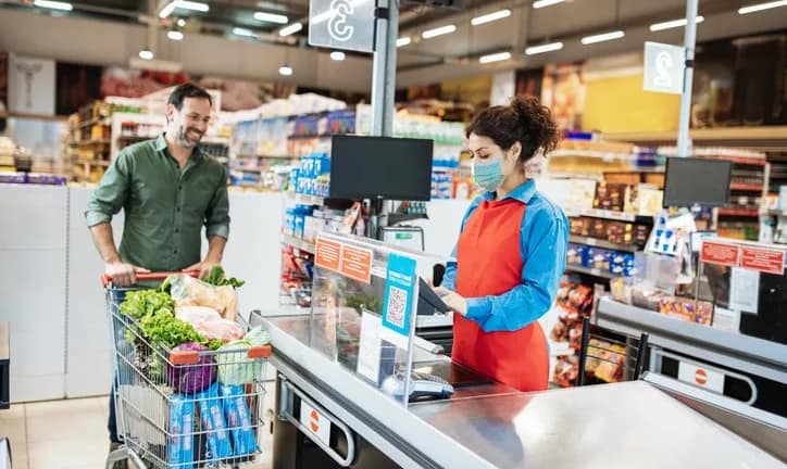 man with grocery cart at cashier.width .jpg