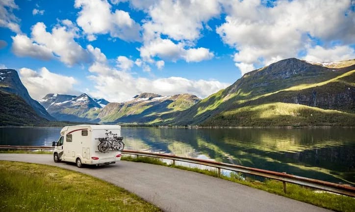 rv driving past mountain lake.width KAplCV.jpg