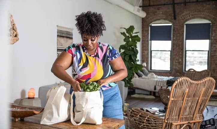 woman unpacking grocery bags.width .jpg