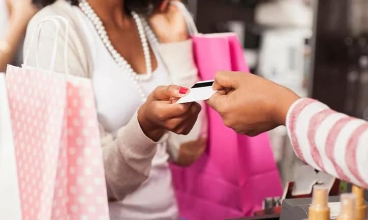 woman with shopping bags credit card ddxVhg.width .jpg