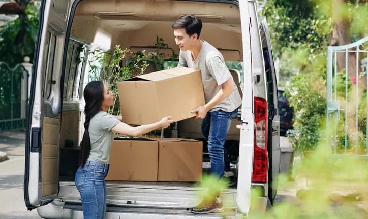 couple unloading boxes from moving van.width pqgddQi.jpg