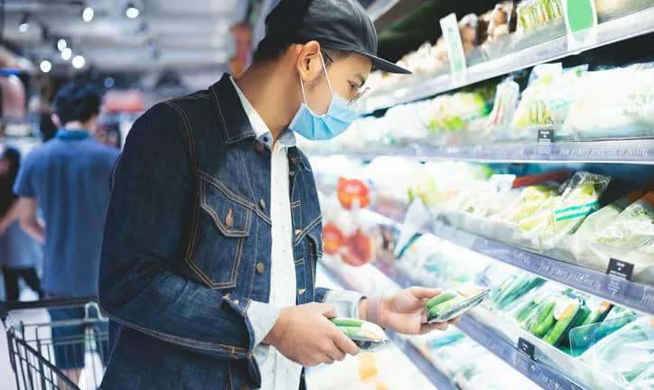 man in mask grocery shopping.width .jpg