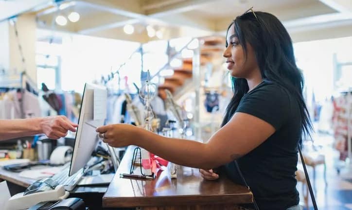 woman paying with credit card lPGSlIQ GwyEw.width .jpg