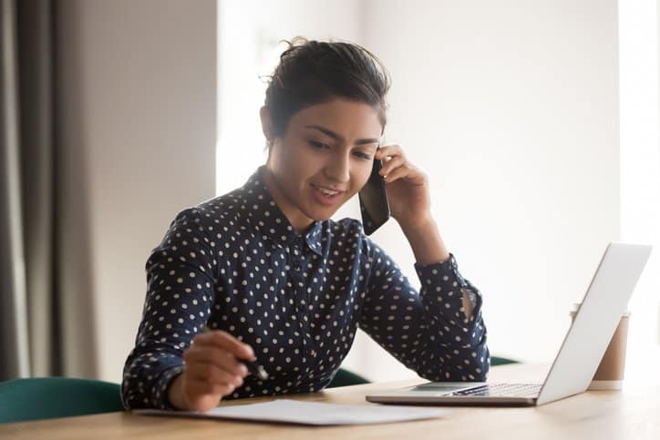 Woman with laptop on phone.width .jpg