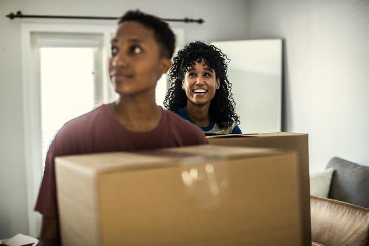 couple carrying moving boxes aOhHD.width .jpg