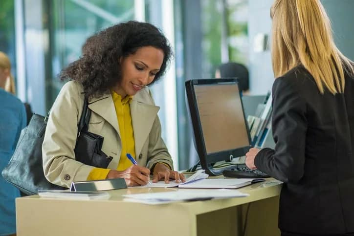 bank customer writing check Vgpp.width .jpg