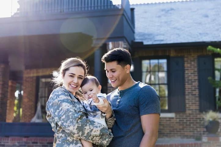 female veteran with baby and husband JxapTO.width .jpg
