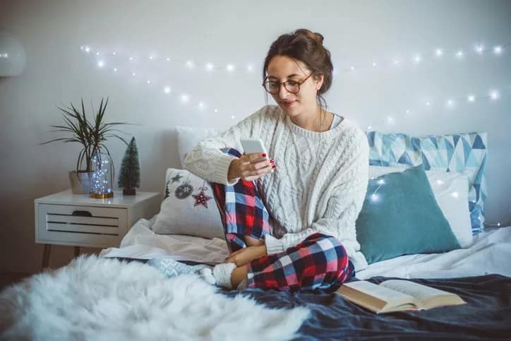 woman on bed on phone.width .jpg
