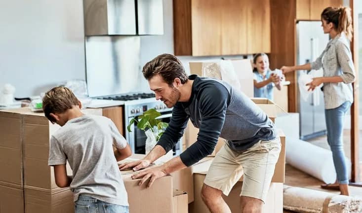 parents and kids packing moving boxes.width .jpg