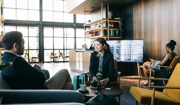 man and woman in airport lounge rQqosD.width .jpg