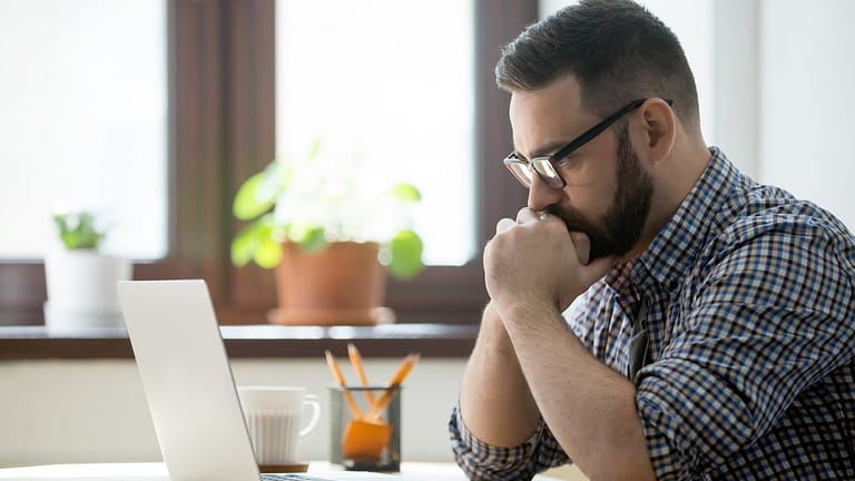 Stressed man with laptop pboAzQu.width