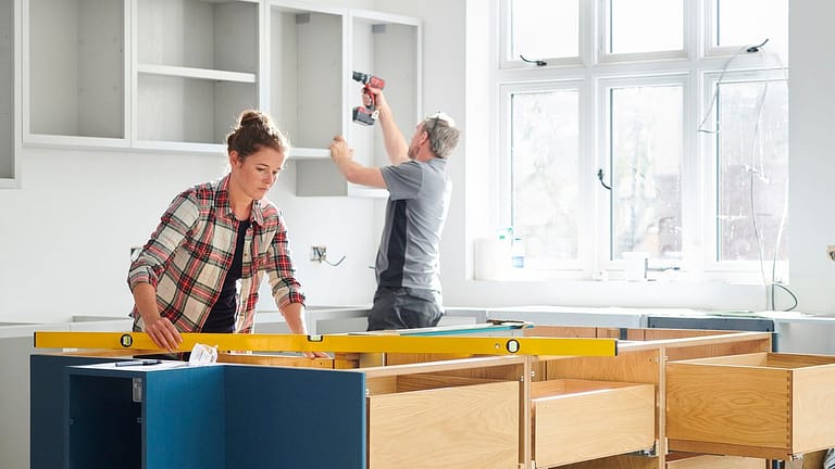Man and woman working on a kitchen remodel TD.width .jpg