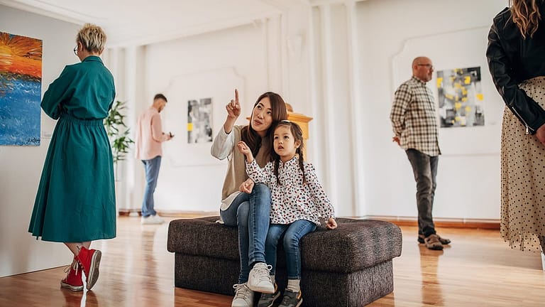 Woman and daughter looking at art in a museum.width deOwmAd.jpg