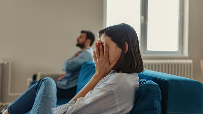 couple having an argument on couch.width .jpg