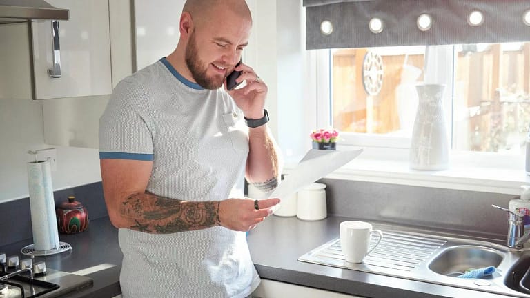 Homeowner on phone with mortgage company pFR.width .jpg