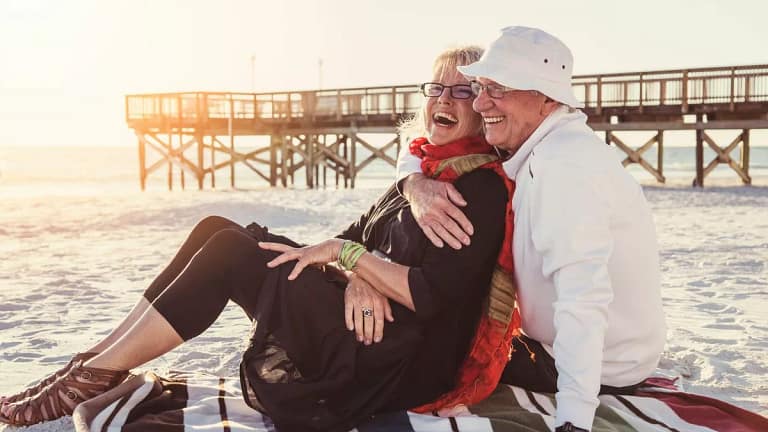 Senior couple embracing on the beach. QTxQl.width .jpg