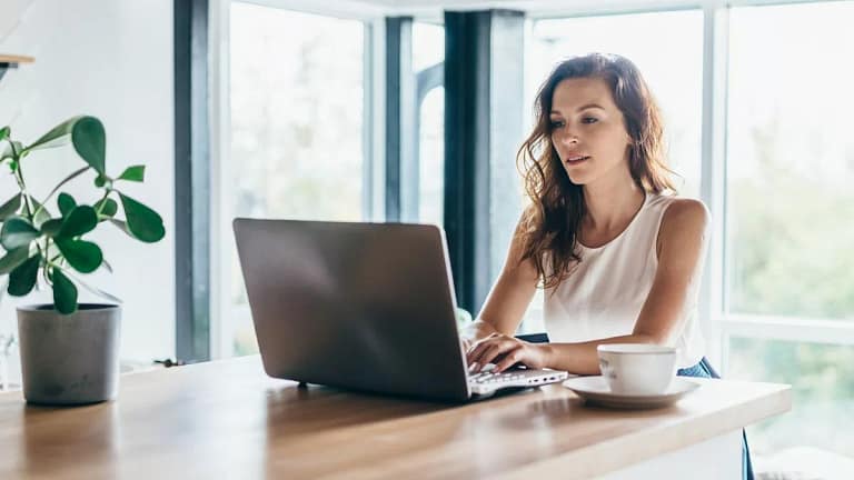 person on laptop at dining table aUpw.width .jpg