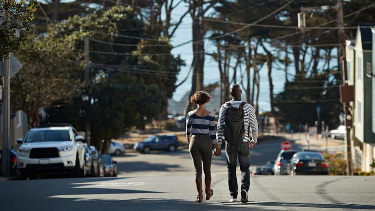 two people walking down street WdvM.width .jpg