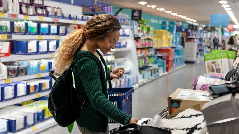 Consumer shopping with basket in a discount s.width .jpg