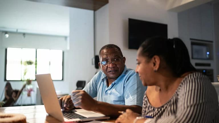 Couple sit and go over finances gXMyEj.width .jpg