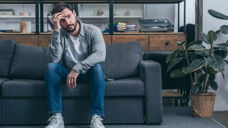 Upset man on couch gSMaXR.width .jpg
