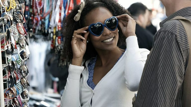 Woman shopping for sunglasses RSnHkOr.width .jpg