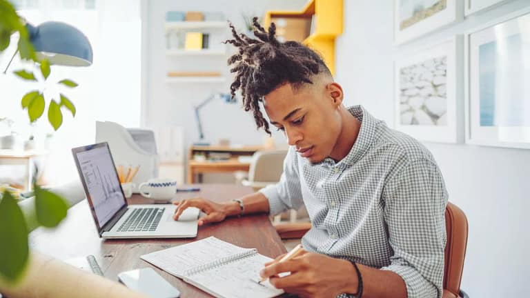 Young man looks over his investment accounts .width .jpg