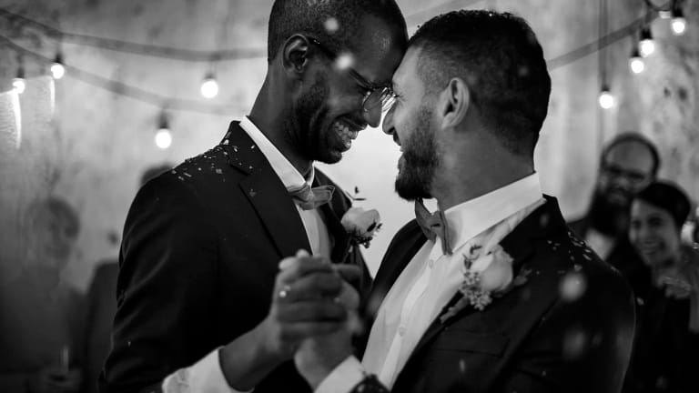 getty smiling couple getting married wedding black and white lgbt gay.jpg