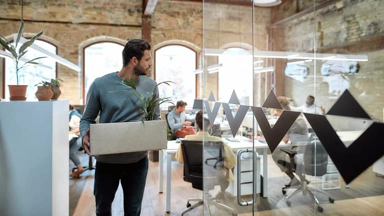 man leaving office with box of things jydesFH.width .jpg
