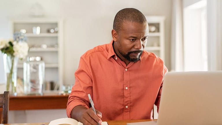 middle aged man at laptop gettyimages .jpg