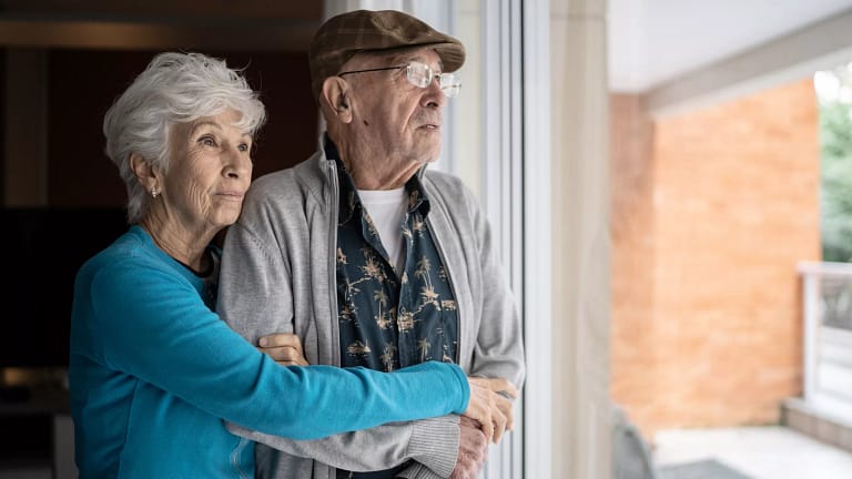 older couple looking out window.jpg