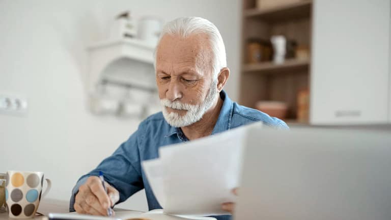 older man at desk serious gettyimages .jpg