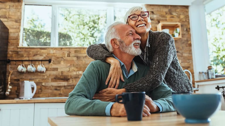 senior couple happy embracing gettyimages .jpg