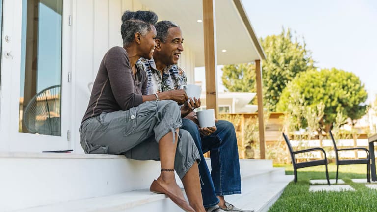 two people sitting on a porch outside.jpg