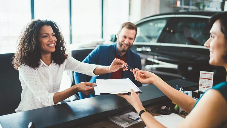 two people buying car from salesperson bfeJF.width .jpg