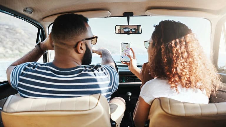 two people driving car HlRq.width .jpg