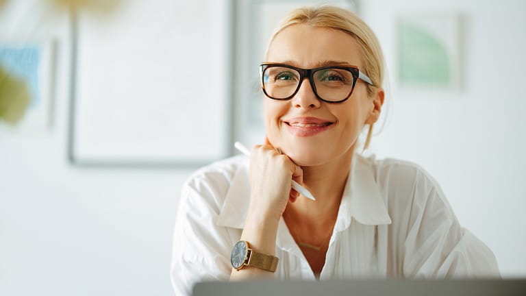 woman smiling laptop s gettyimages .jpg
