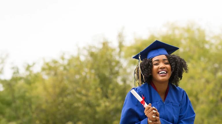 young smiling woman on graduation day wearing.width iYtpT.jpg