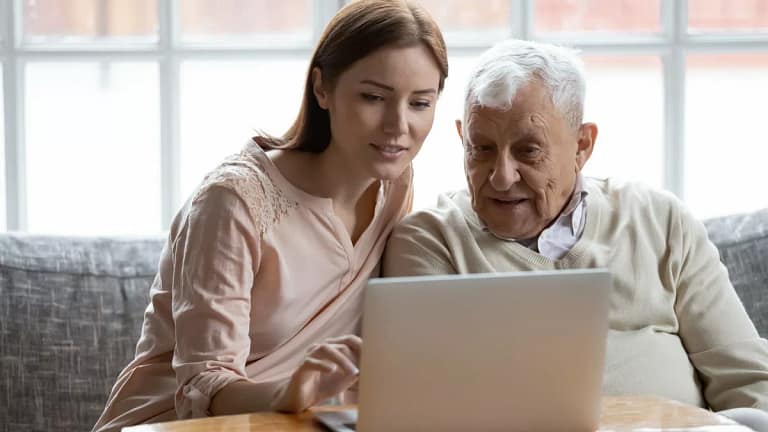 Yound adult woman looking at laptop and talki.width bTSCBAk.jpg