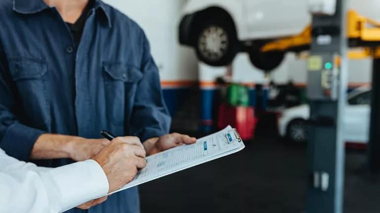 car mechanic signing bill UzgJNlX.width .jpg