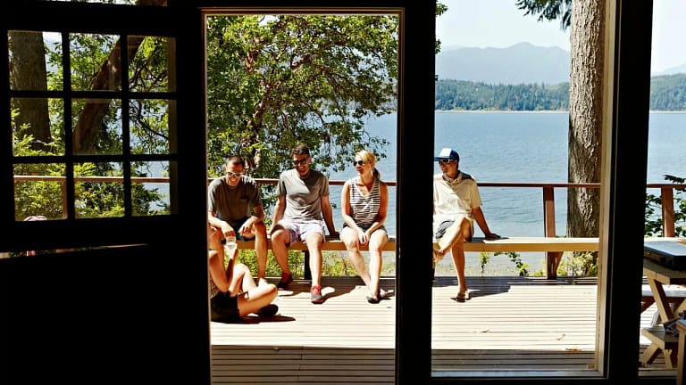 friends on deck of lake house sMCcwwu.width .jpg