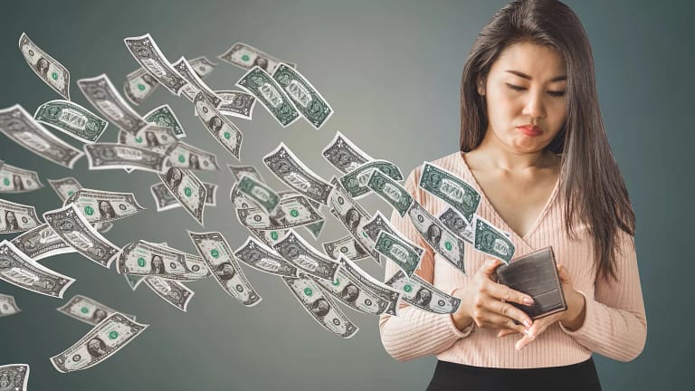 getty lose money fees debt down the drain empty wallet.jpg