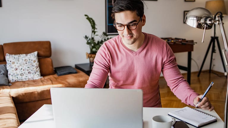 man s laptop smiling gettyimages .jpg