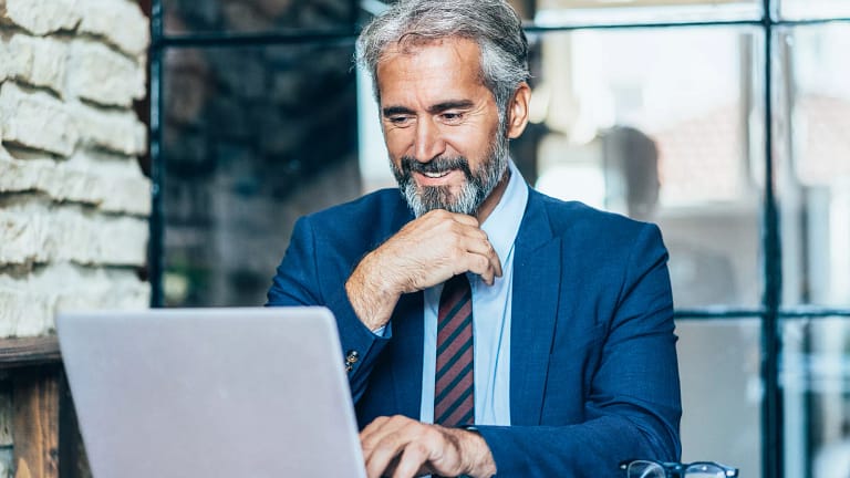 man older business suit laptop gettyimages .jpg