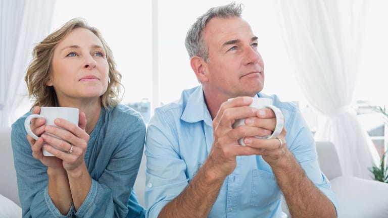 middle aged couple coffee cups.jpg