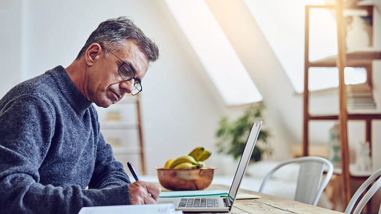 older man at laptop taking notes gettyimages .jpg