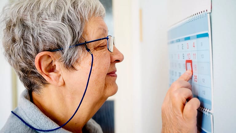 older woman looking at calendar.jpg